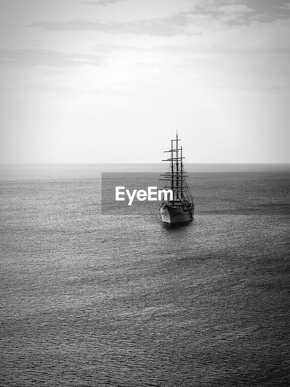 Sailboat sailing on sea against sky