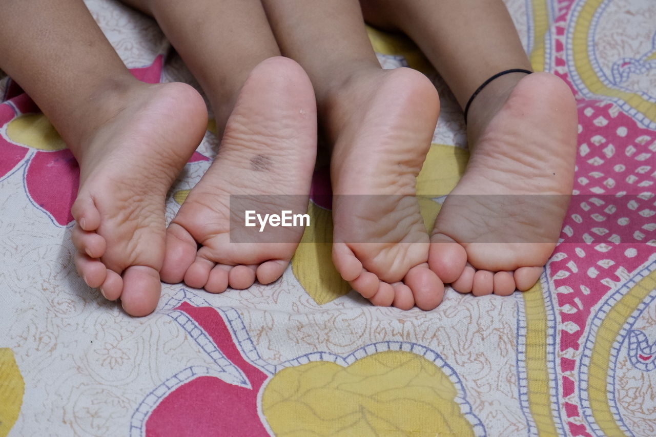 LOW SECTION OF BABY FEET