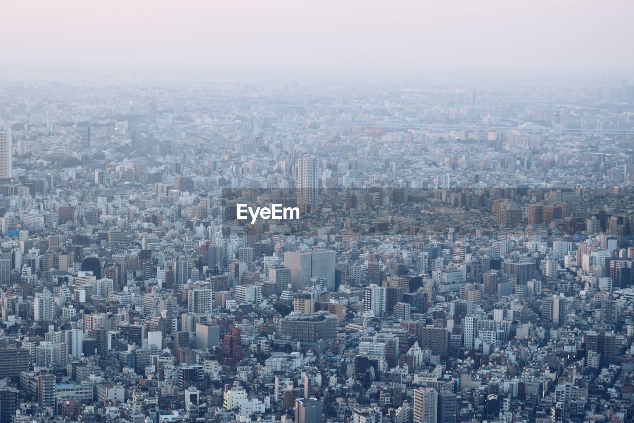 High angle view of buildings in city against sky