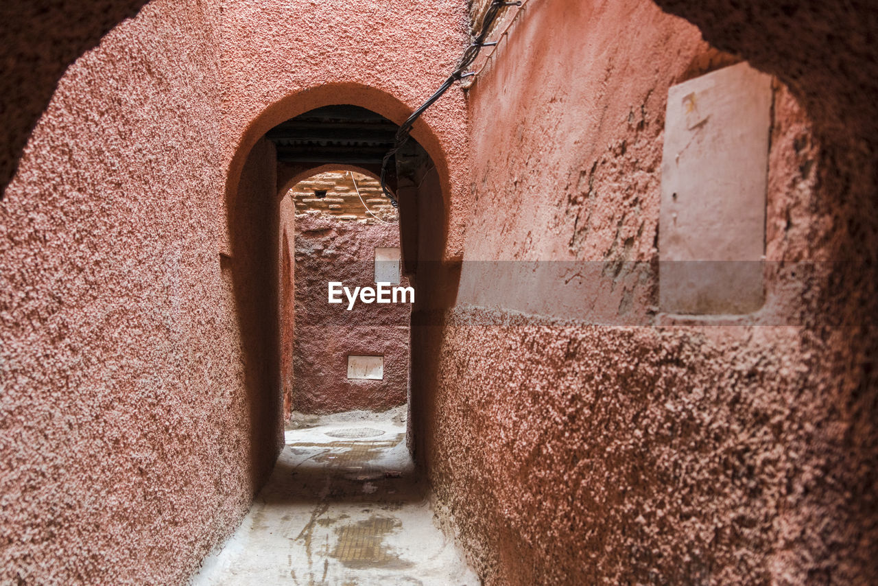 Small passage or alley in medina in marrakesh colored in orange