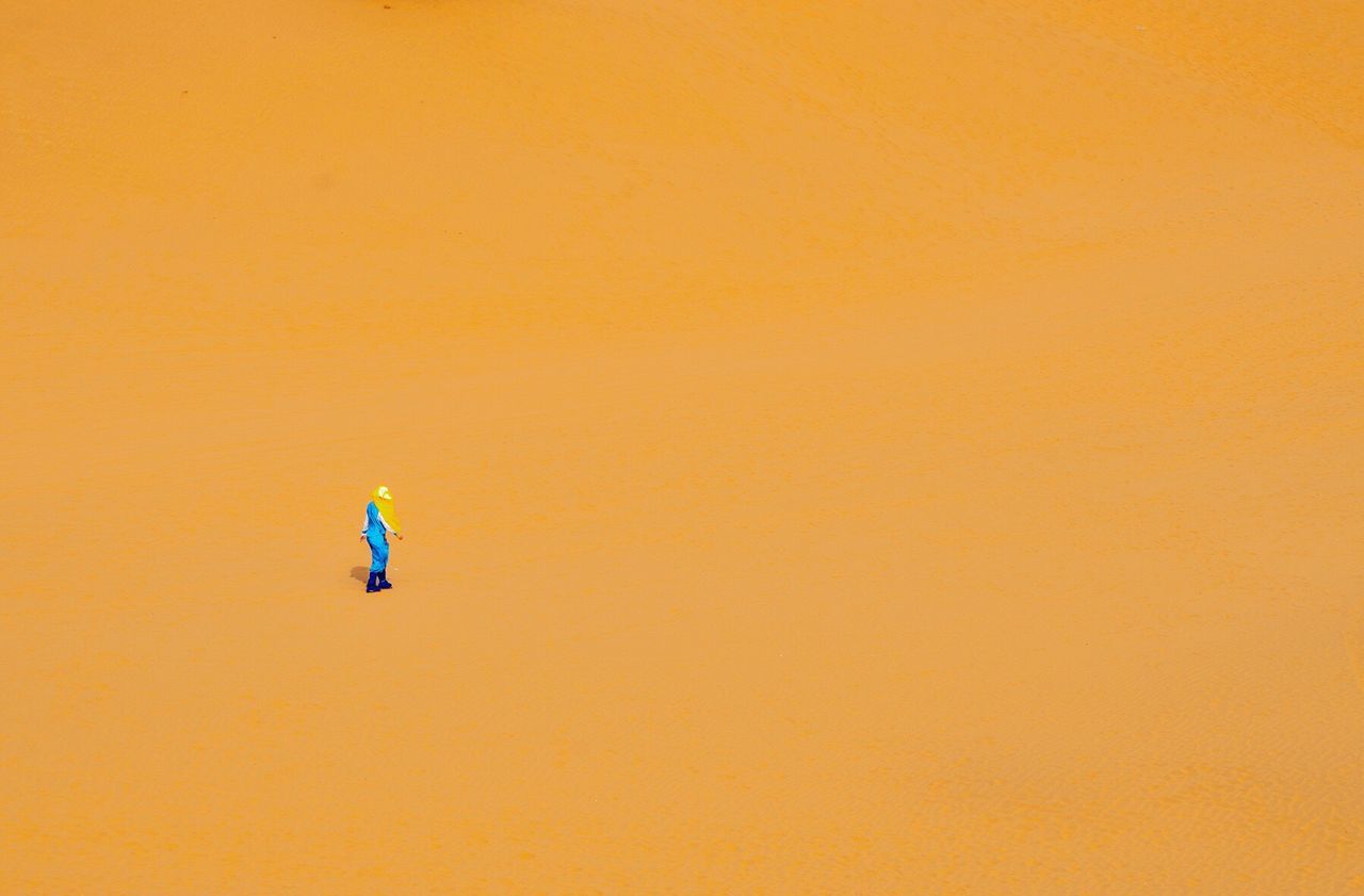 Person walking on sand in desert