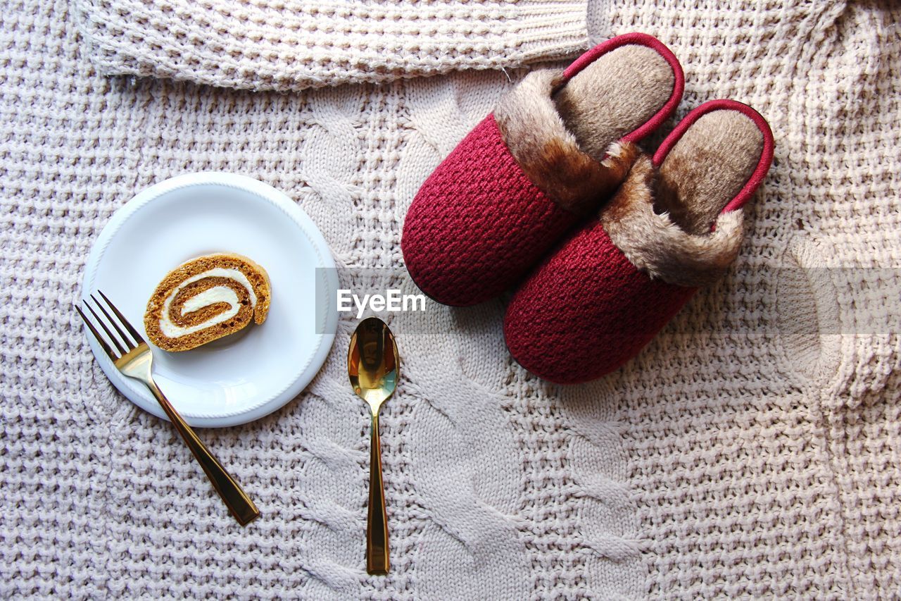 High angle view of food and shoes on table