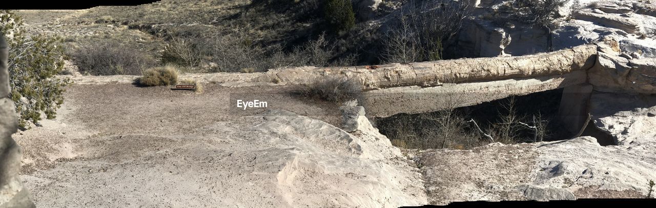 WATER FLOWING THROUGH ROCKS IN GLASS