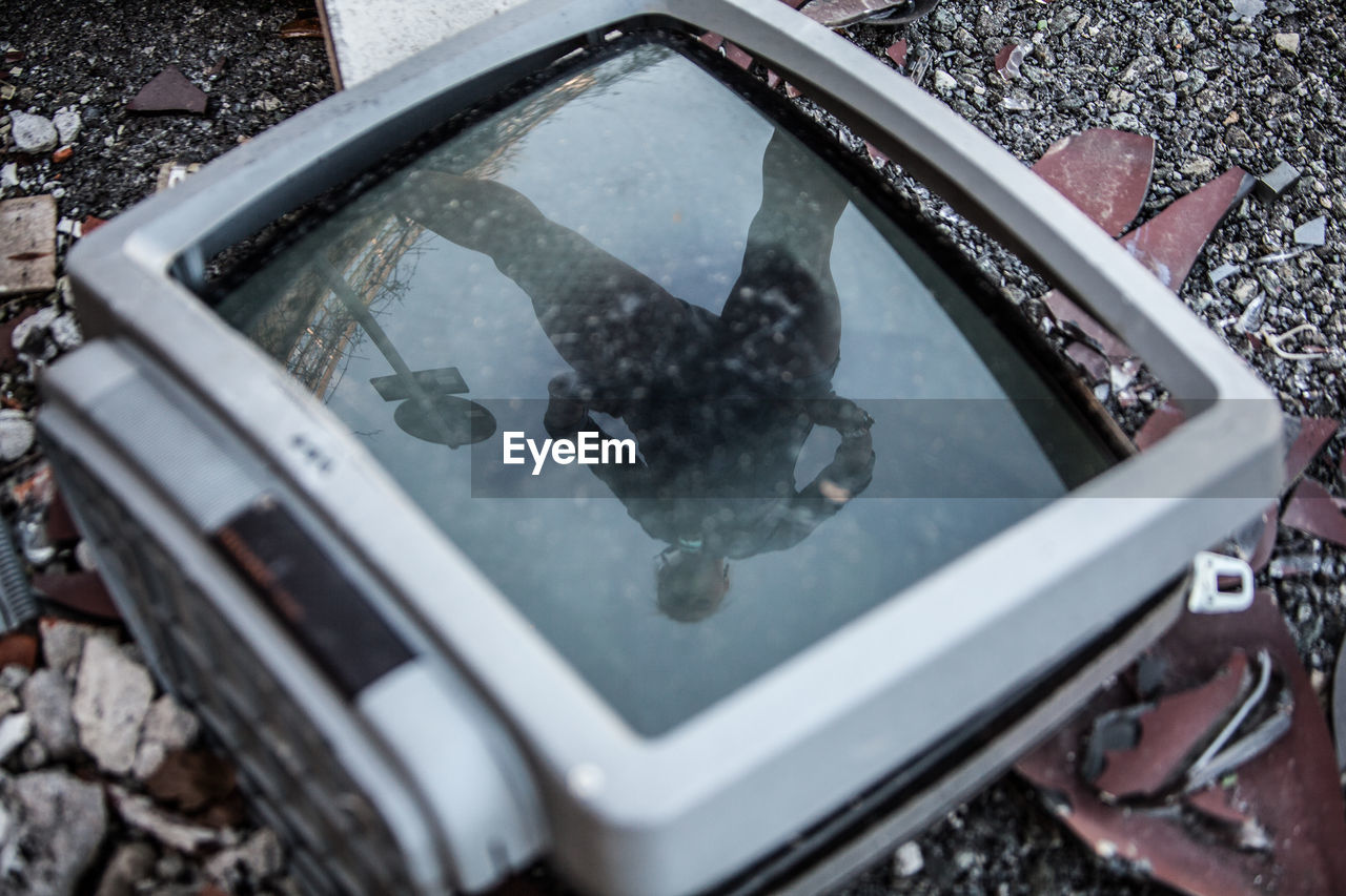 CLOSE-UP REFLECTION OF PUDDLE