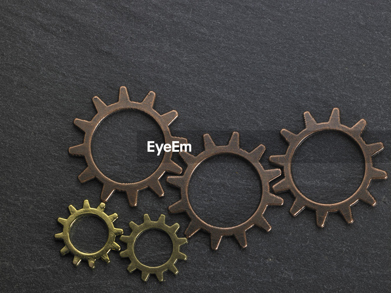 Close-up of gears on black table