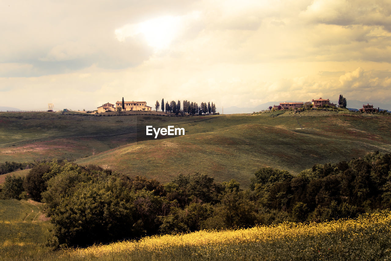 Scenic view of landscape against cloudy sky