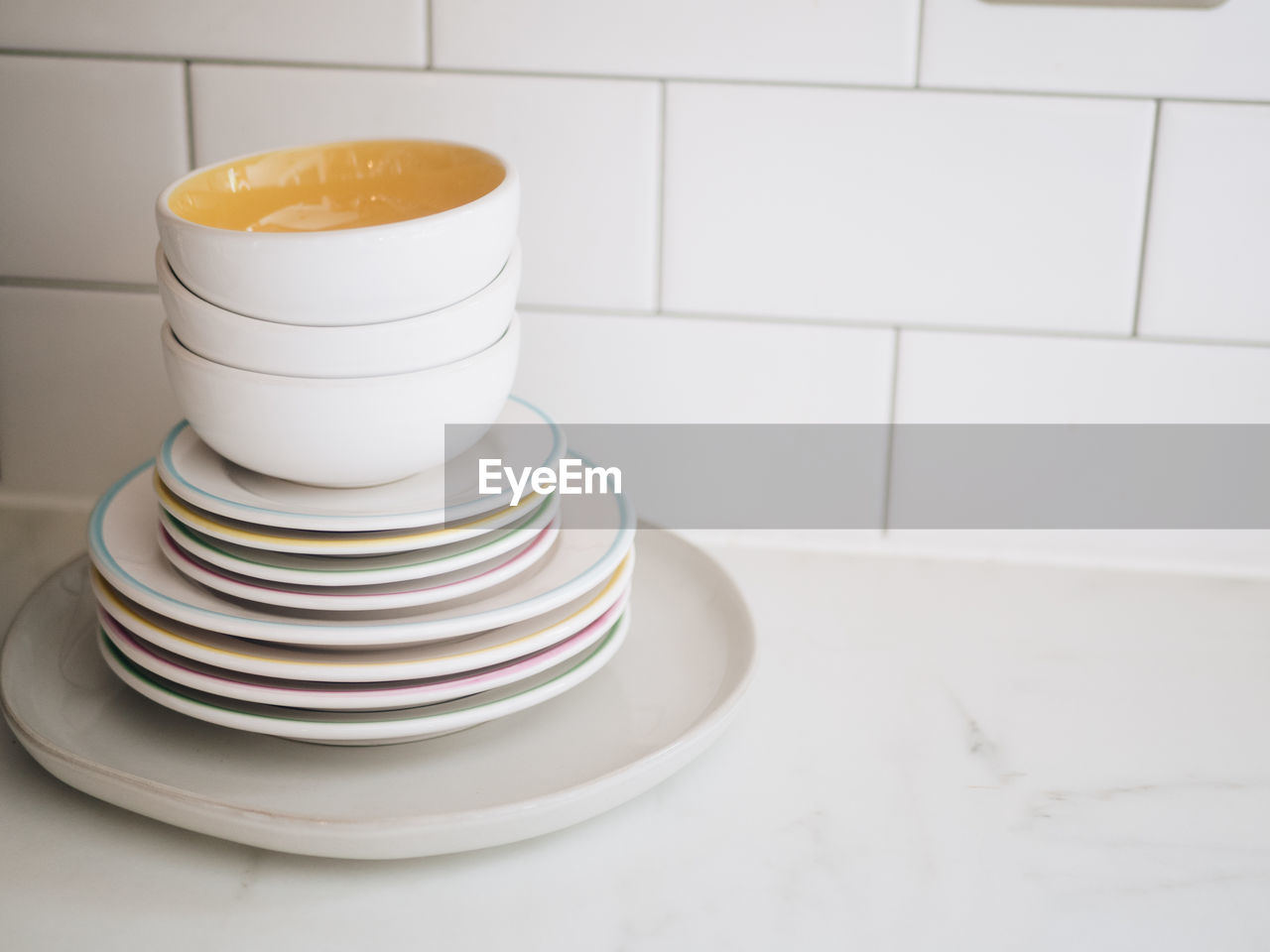 Stack of plates and bowls on table