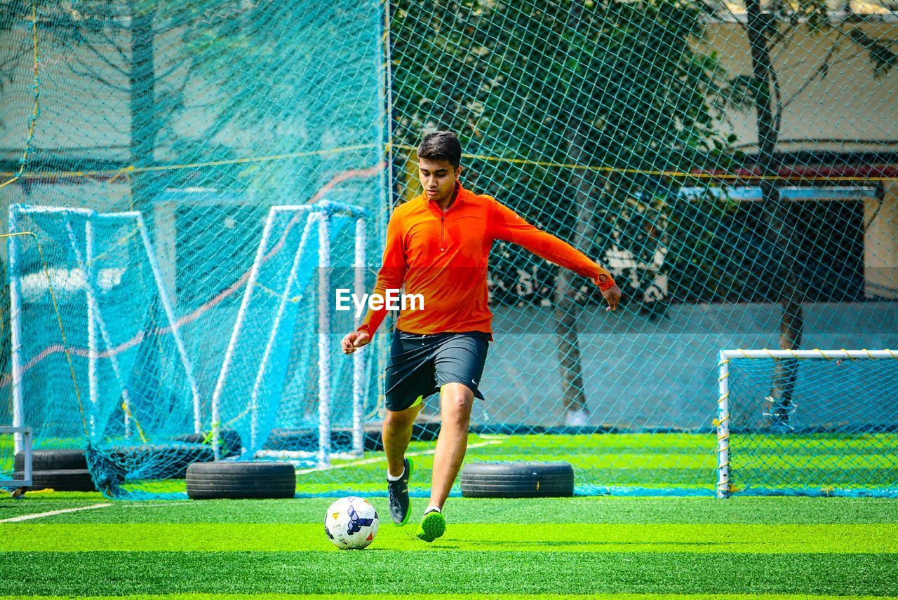 Man playing soccer on field