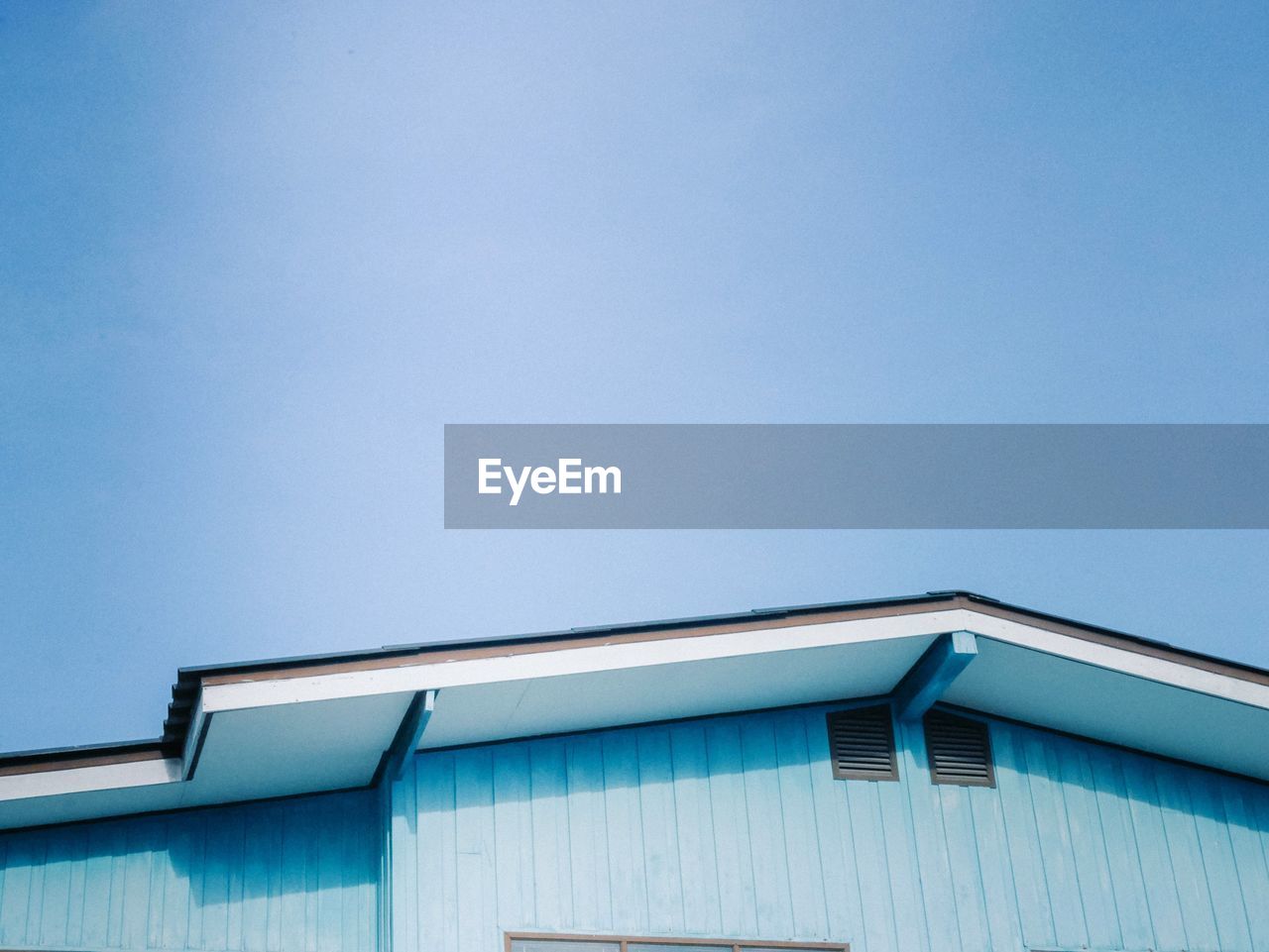 Low angle view of building against blue sky