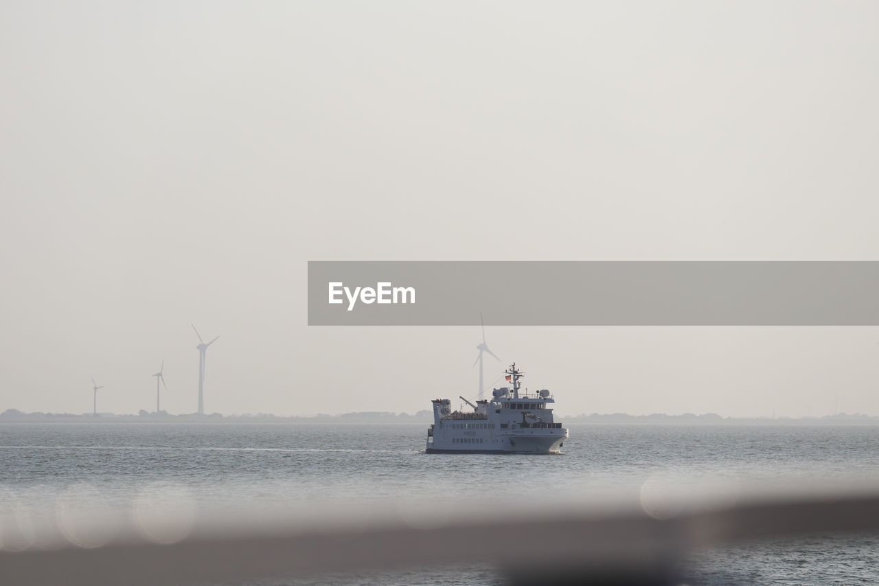 Ferry as passanger ship on its way through the wadden sea to a island in friesland