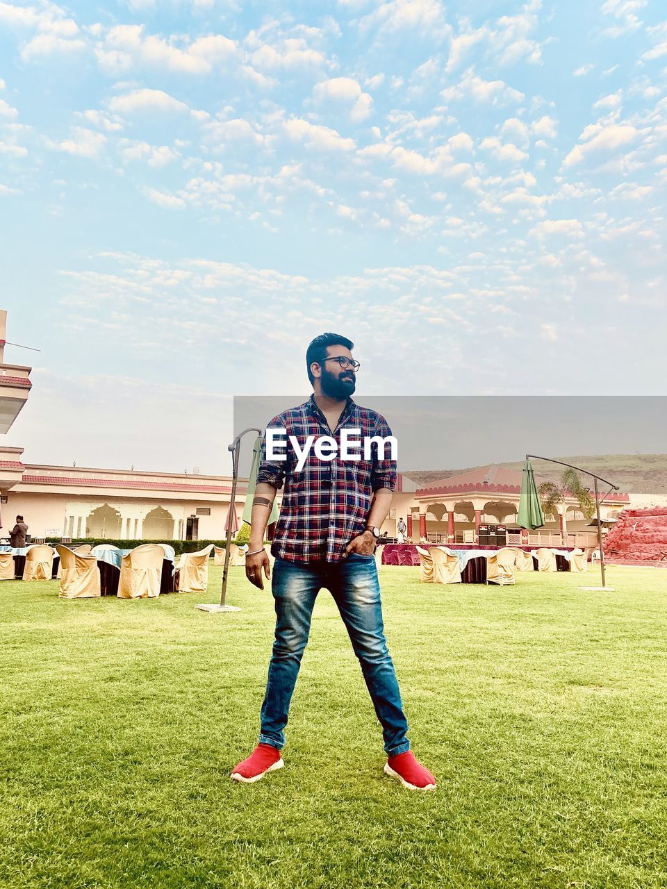 Full length of man standing on grassy field