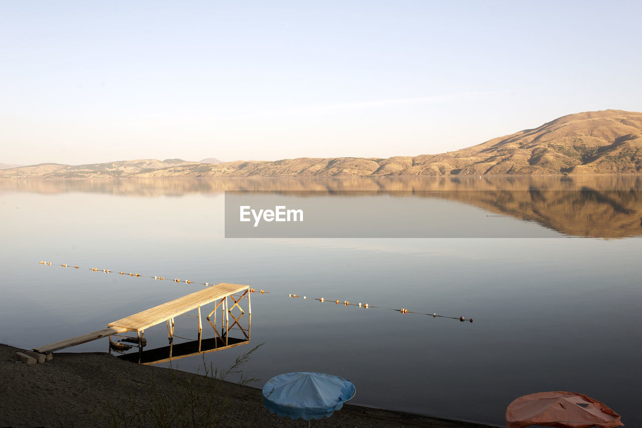 High angle view of pier on lake against sky