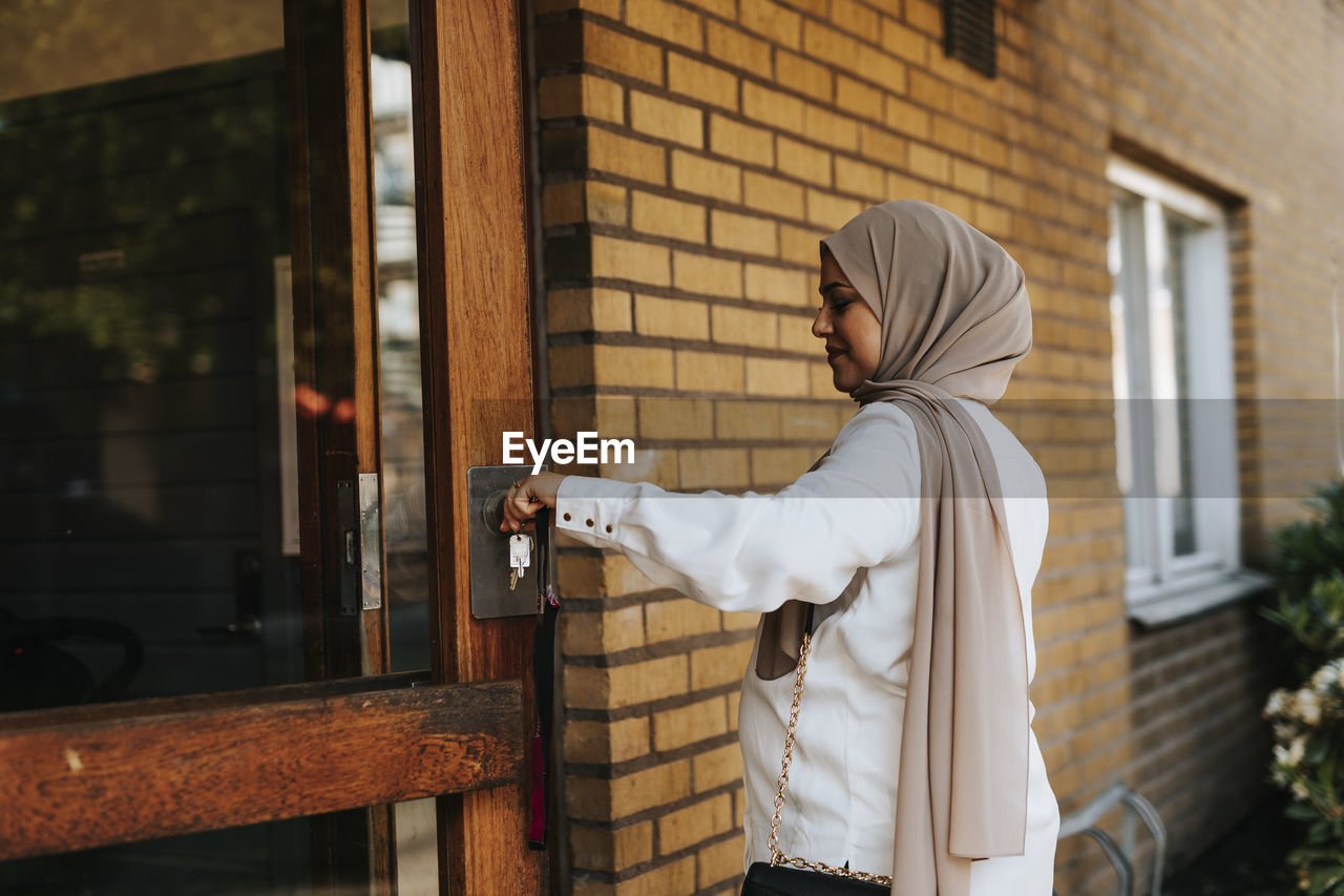 Woman entering building