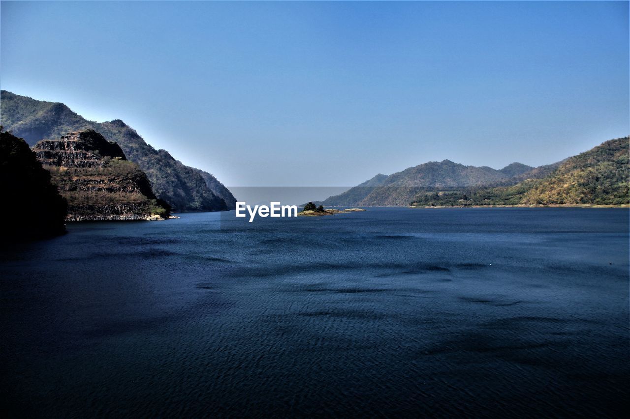 Scenic view of sea against blue sky