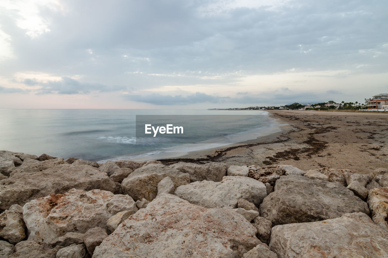 Scenic view of sea against cloudy sky