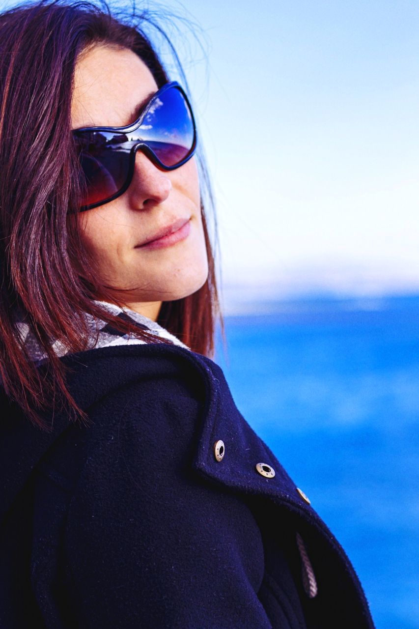 Close-up of confident woman wearing sunglasses