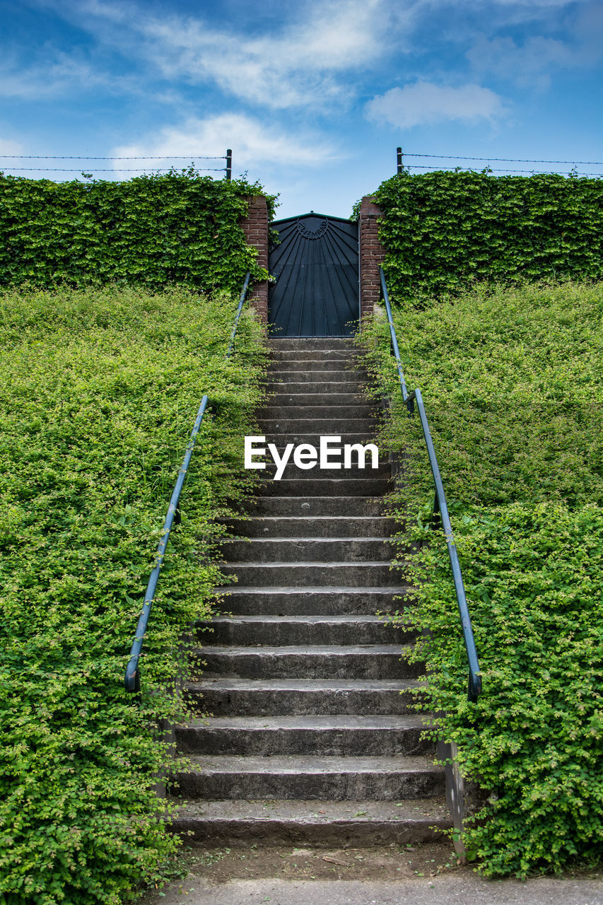 Low angle view of steps on field against sky