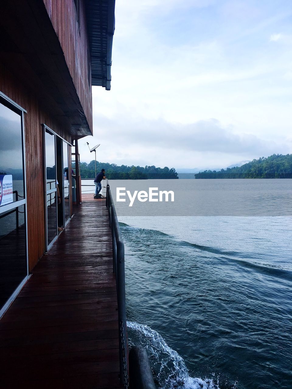 Man admiring view from boat deck