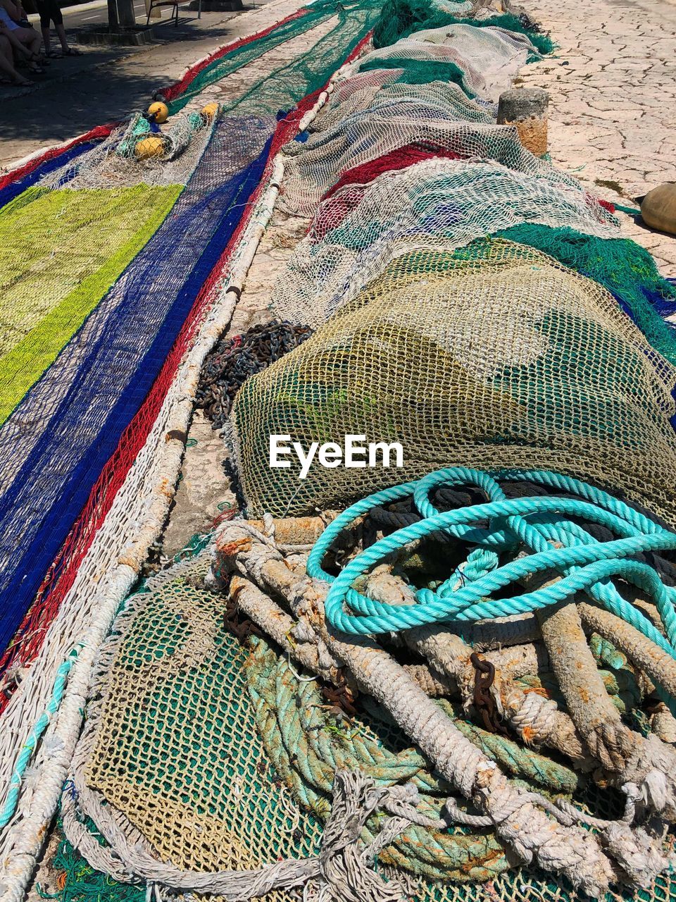 HIGH ANGLE VIEW OF FISHING NET ON SHORE