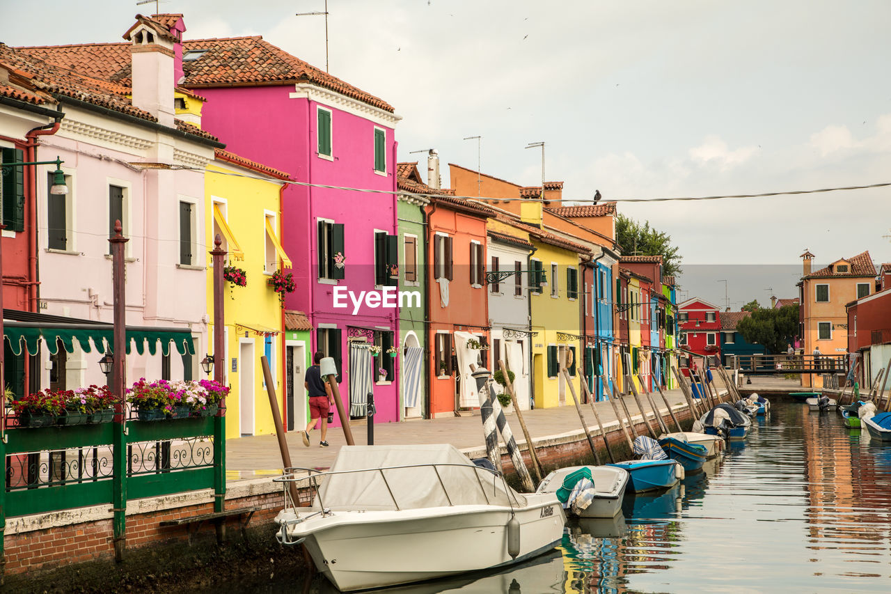 Boats on canal in city