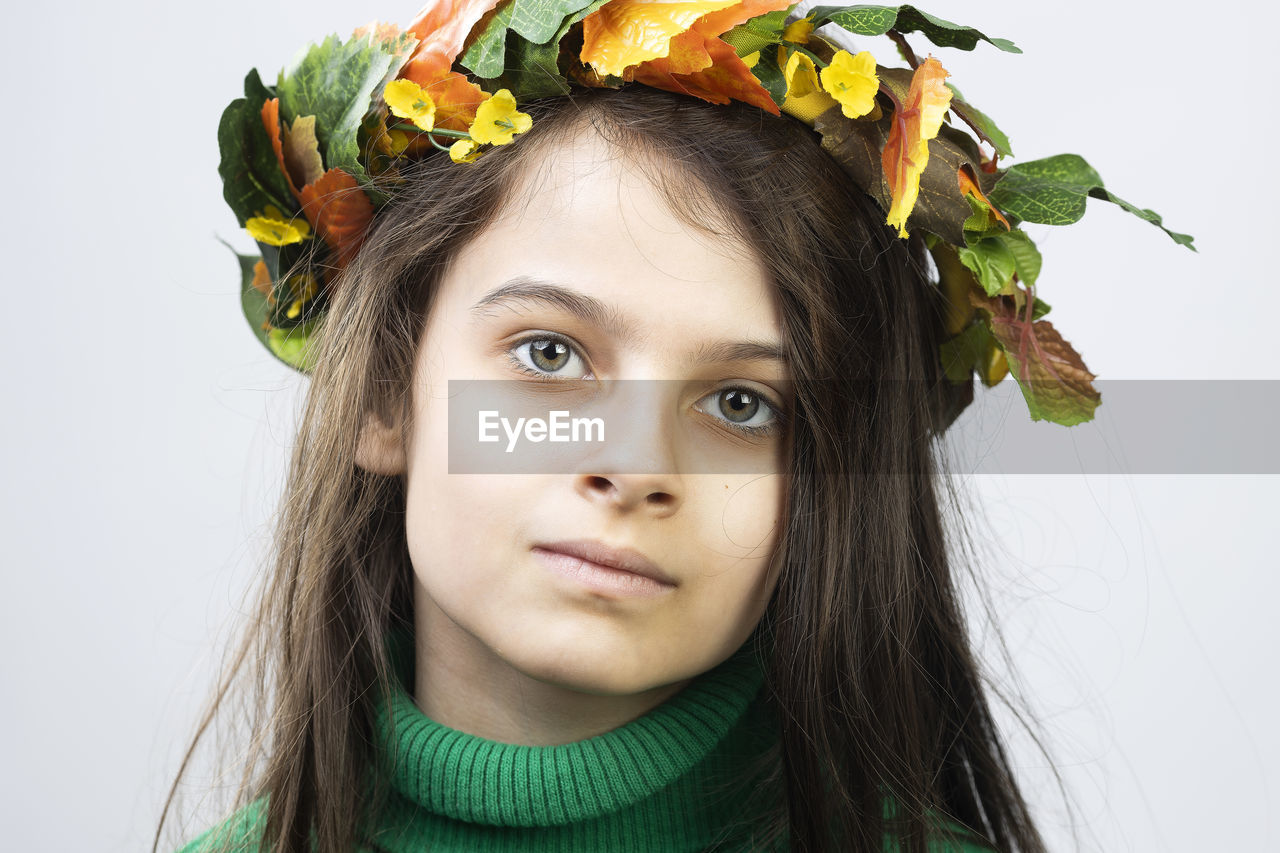 Portrait of a girl 7 years old on a white background