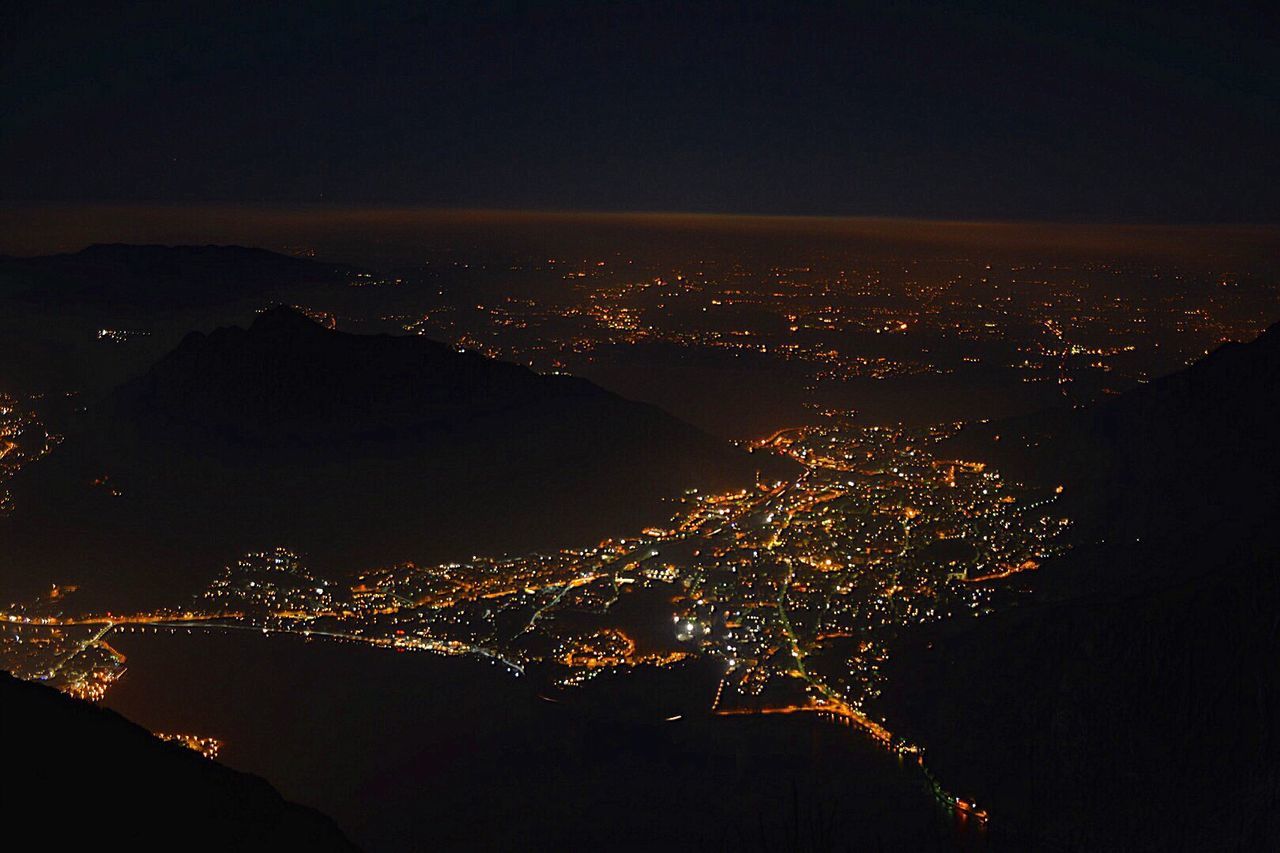 AERIAL VIEW OF CITY AT NIGHT