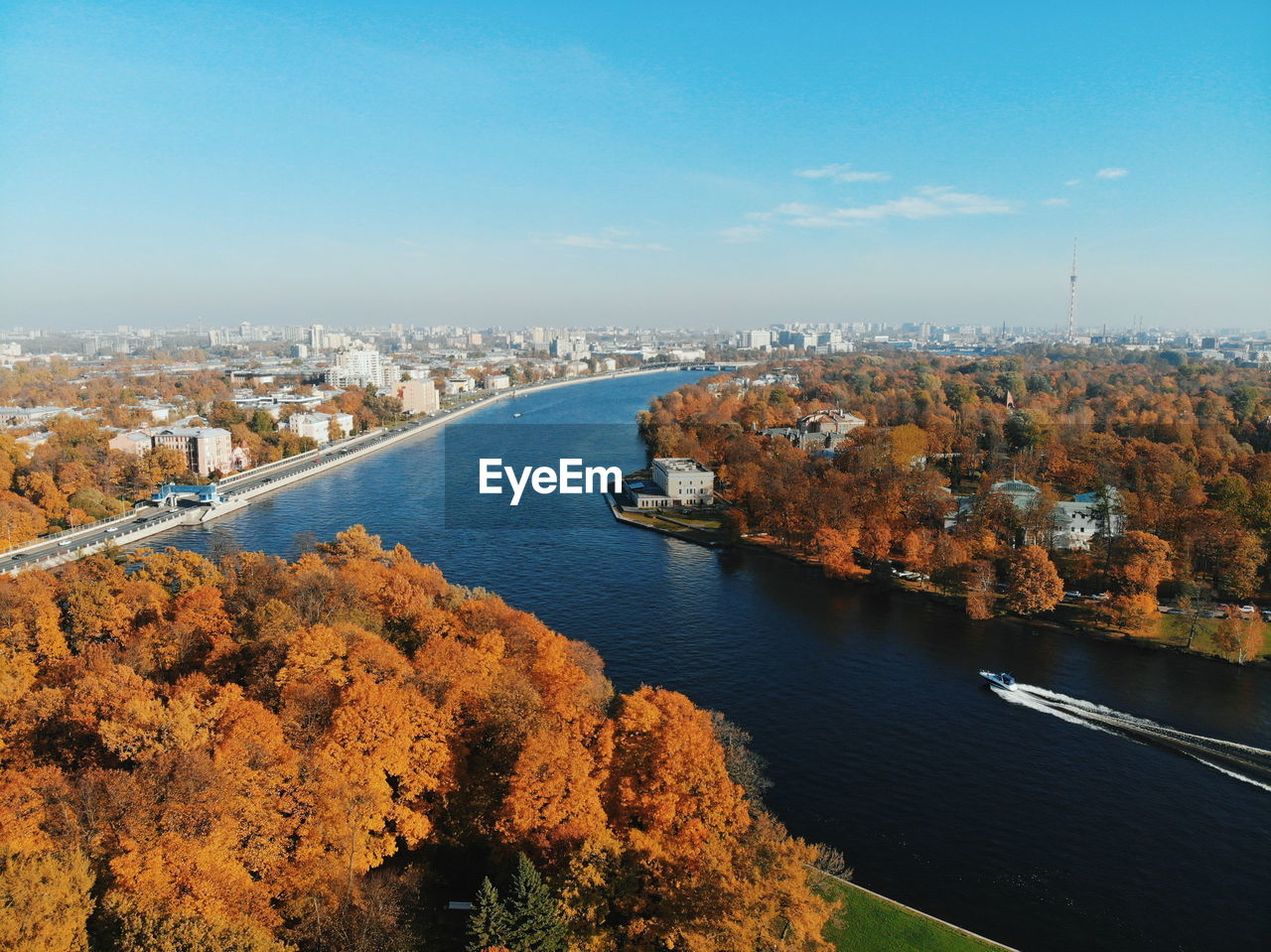 High angle view of river amidst city against sky