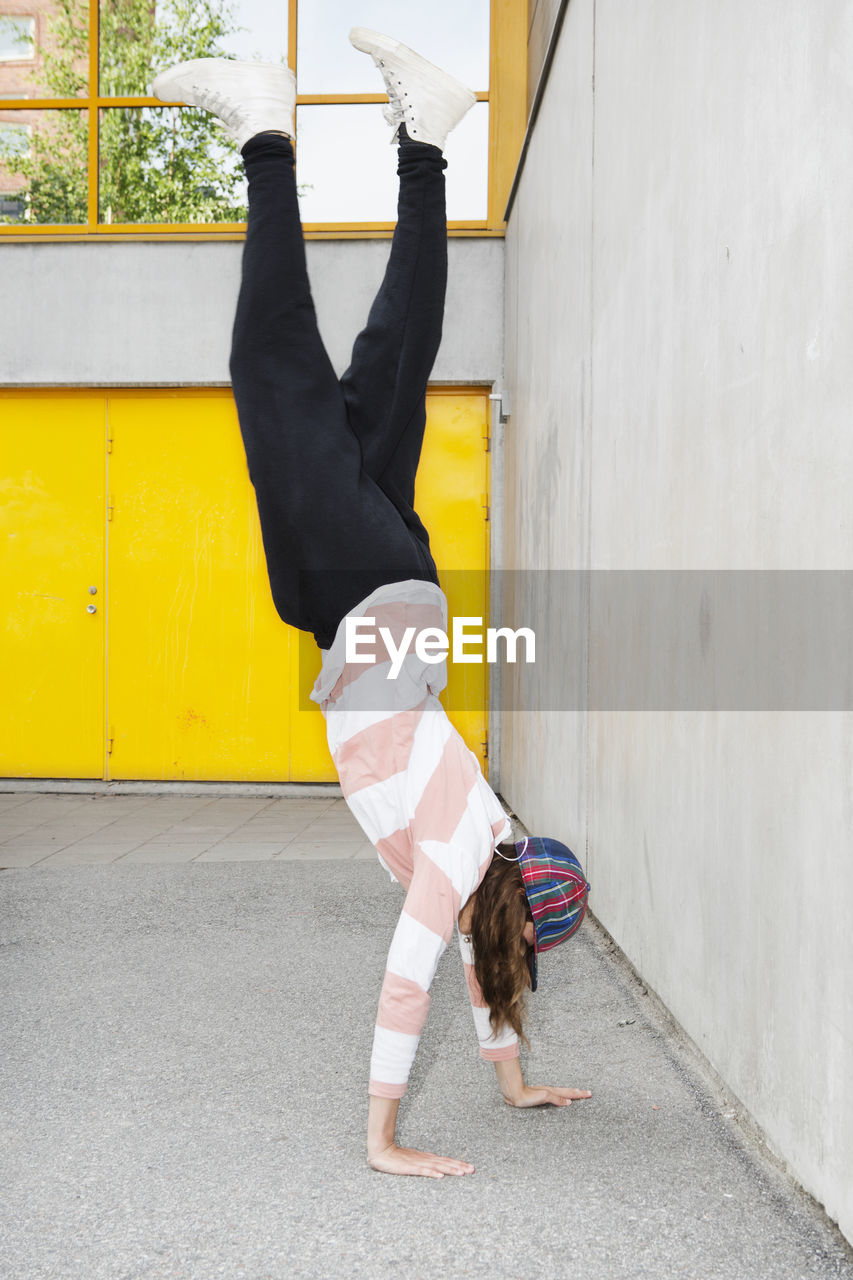 Teenage girl doing handstand, stockholm, sweden