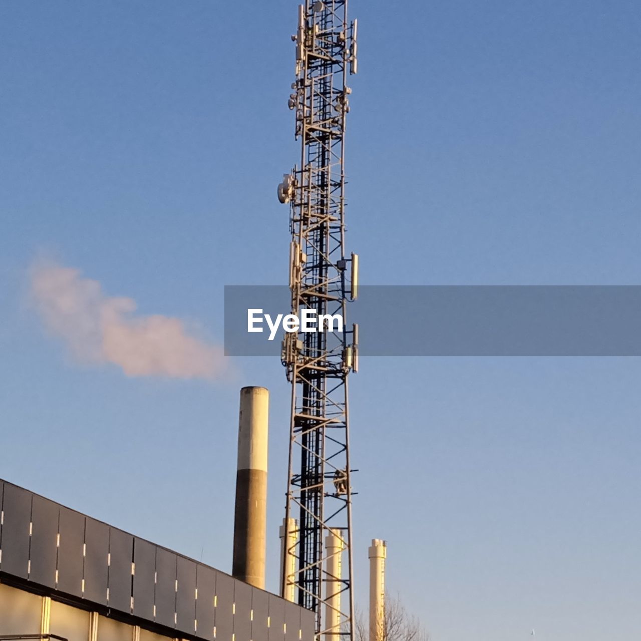 sky, built structure, architecture, technology, industry, nature, metal, low angle view, no people, blue, tower, building exterior, outdoors, clear sky, day, communication, communications tower, copy space, power generation, sunny, business finance and industry, steel, wireless technology, vehicle