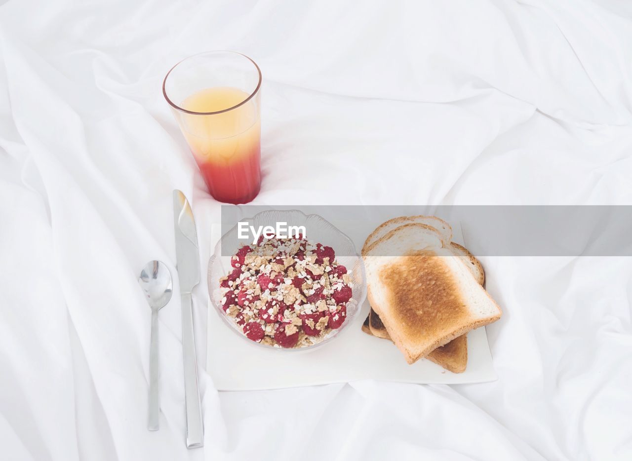 High angle view of breakfast on tablecloth