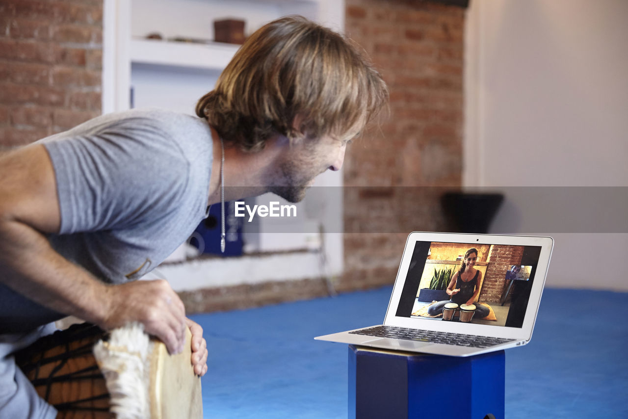 Man video conferencing at home