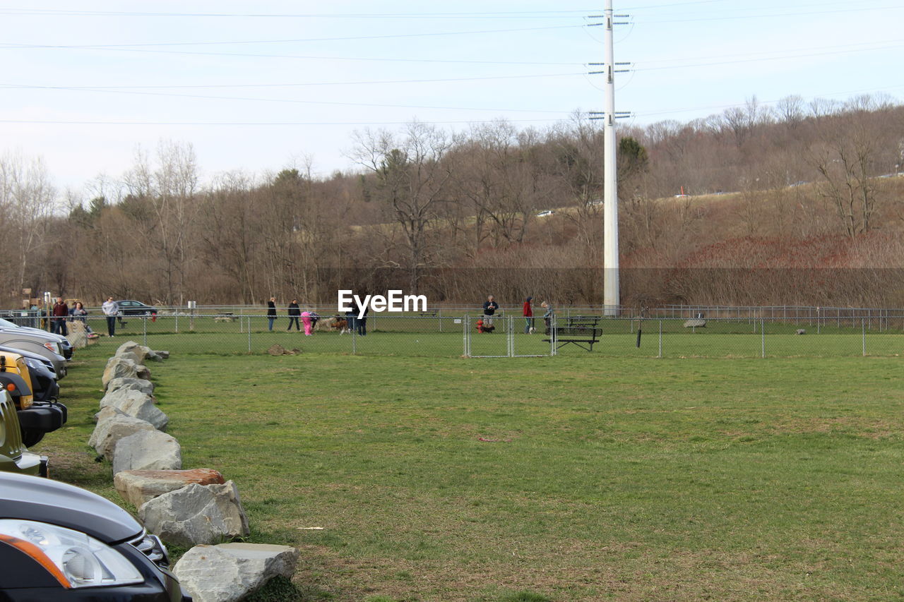 PEOPLE WALKING ON FIELD