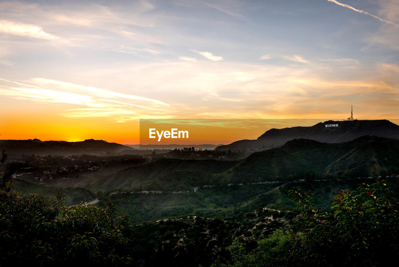 Scenic view of landscape against sky during sunset