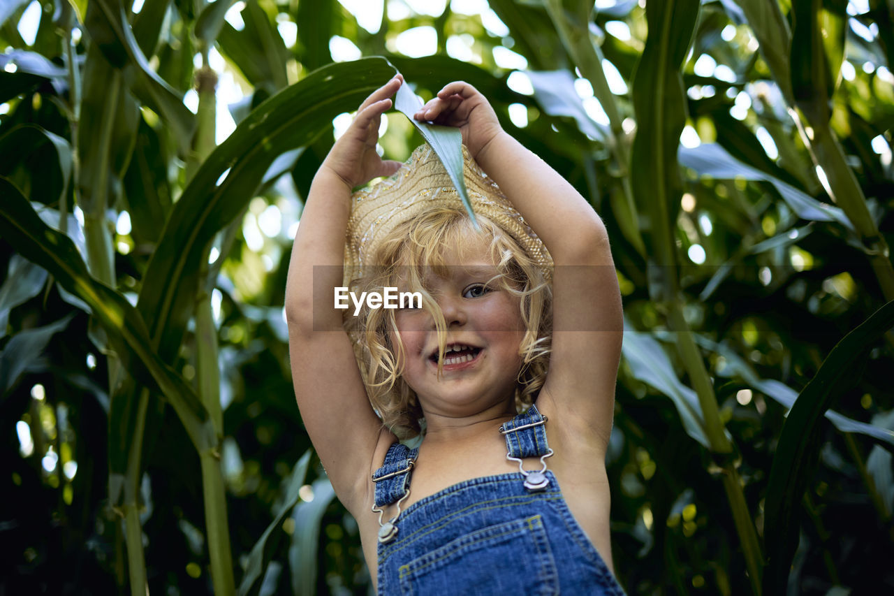 Portrait of smiling girl with plants