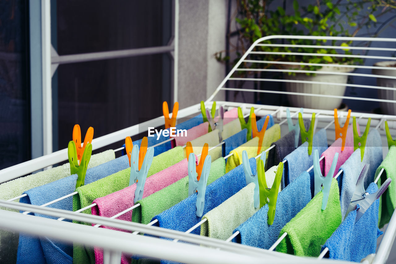 Close-up of multi colored microfiber towel on clothespin