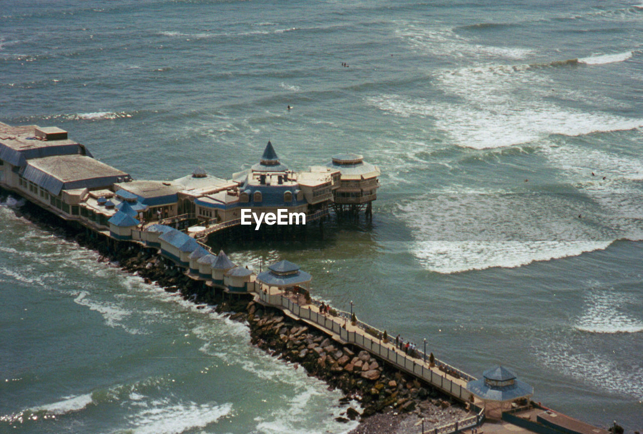 VIEW OF BOATS IN SEA