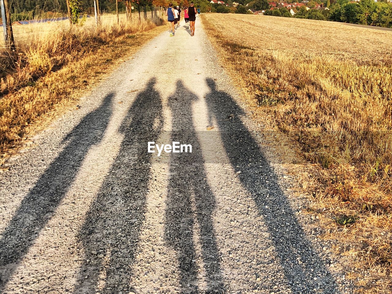 PEOPLE ON ROAD IN CITY