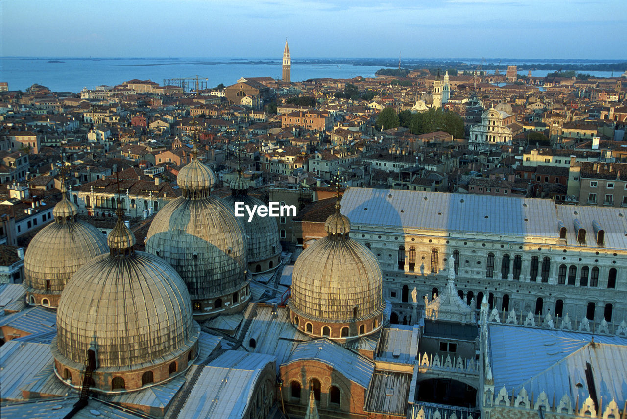 HIGH ANGLE VIEW OF CITY BUILDINGS AT WATERFRONT