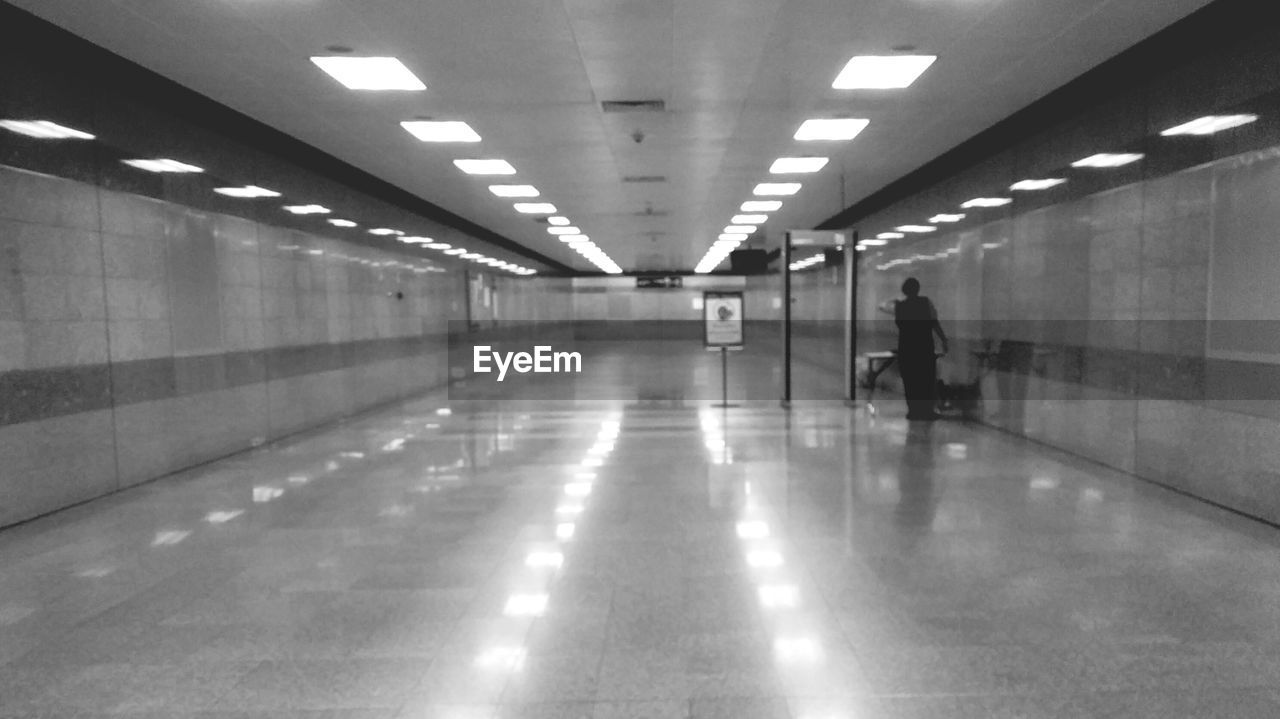 VIEW OF ILLUMINATED UNDERGROUND WALKWAY