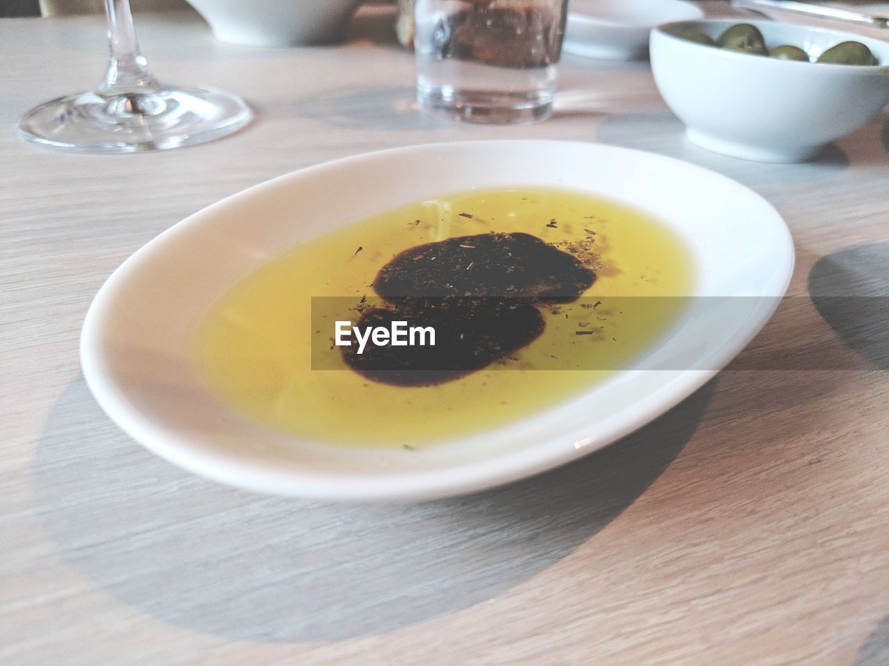 High angle view of tea served in saucer on table 