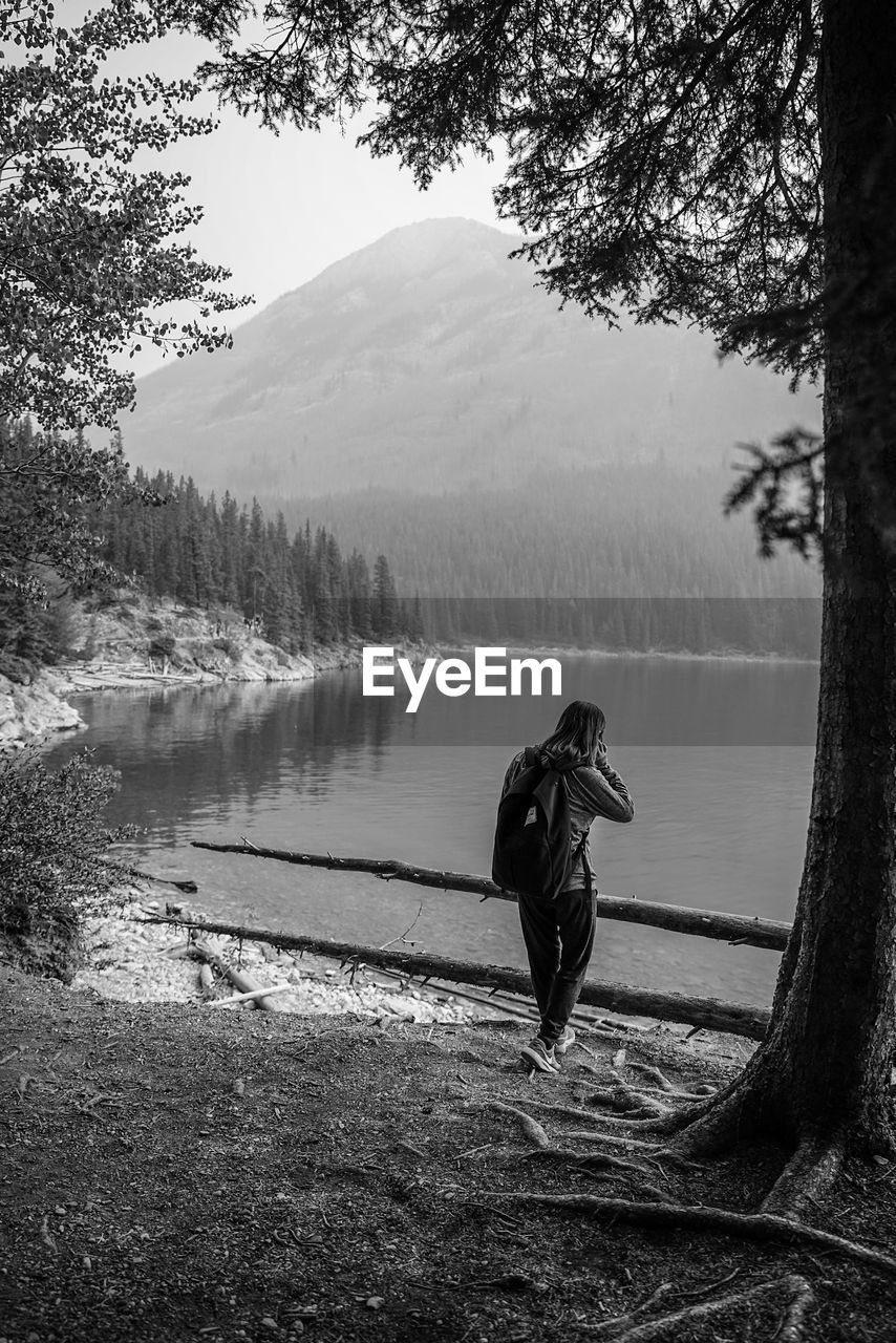 REAR VIEW OF MAN IN LAKE