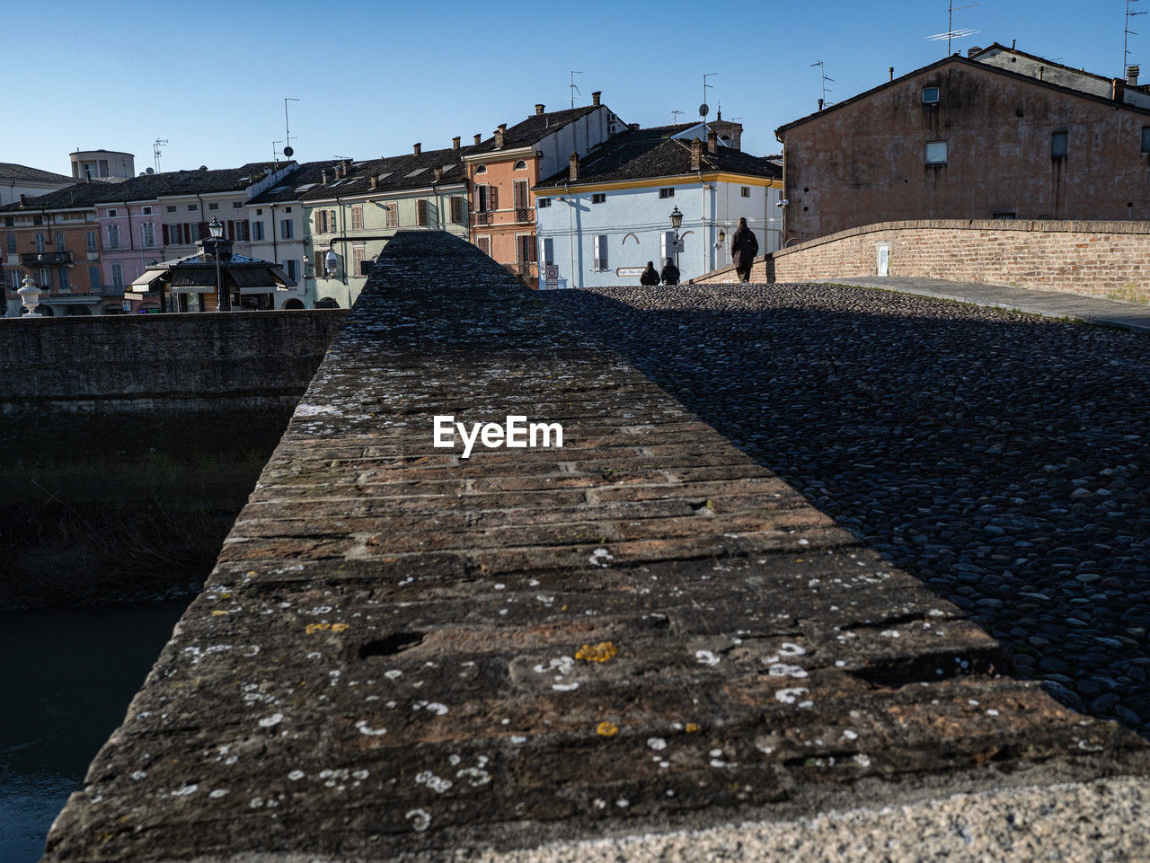 architecture, built structure, building exterior, sky, city, nature, building, history, travel destinations, the past, water, clear sky, sea, travel, wall, urban area, ancient history, tourism, street, no people, sunny, coast, outdoors, town, day, blue, transportation, old, house, religion
