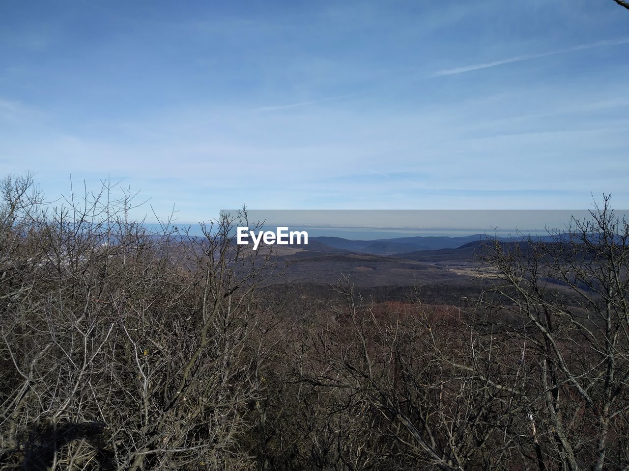 SCENIC VIEW OF LAND AGAINST BLUE SKY