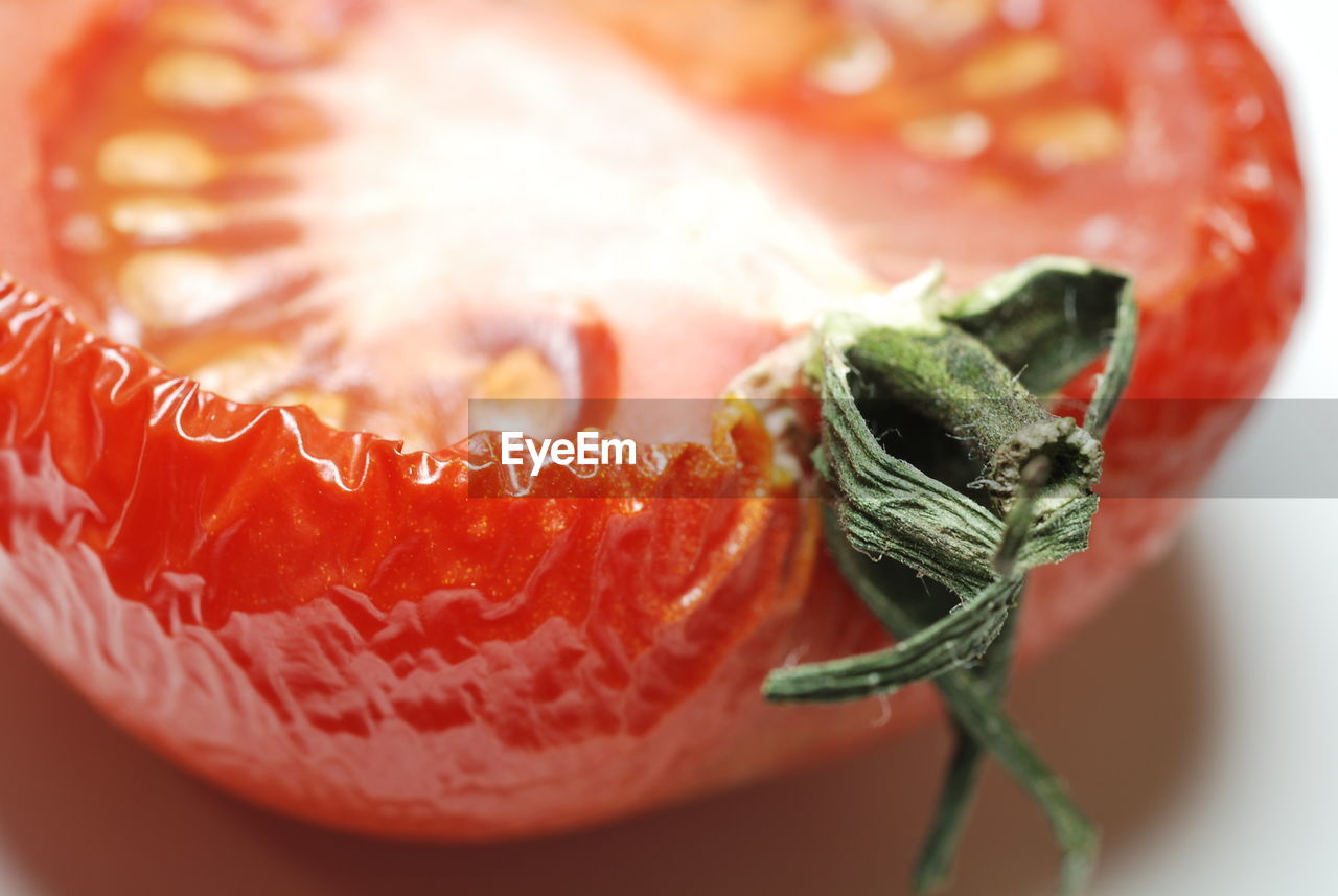 Close-up of tomato on white background