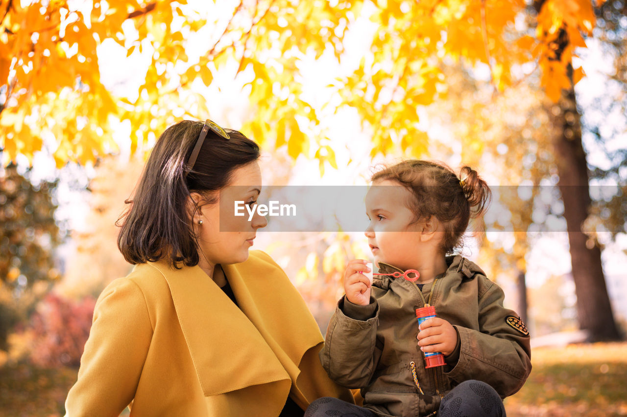 Woman with daughter at public park