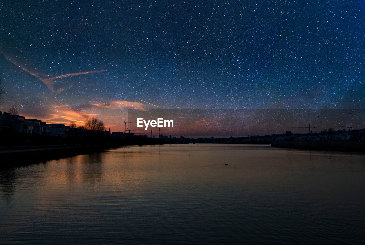 VIEW OF RIVER AGAINST SKY AT NIGHT