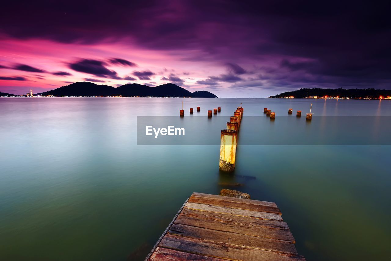 Scenic view of lake against sky during sunset