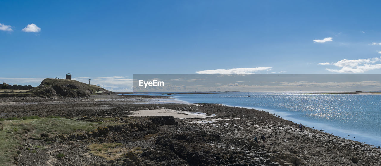 Scenic view of sea against sky on holy island