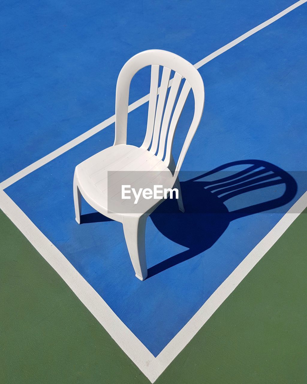 High angle view of chair on tennis court