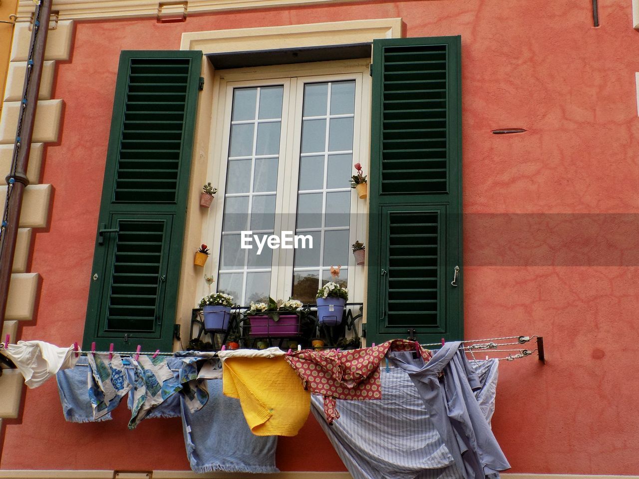 Clothes drying against building